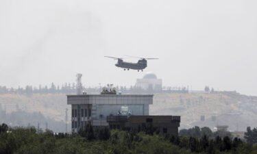 A US Chinook helicopter flies near the U.S. Embassy in Kabul on Sunday