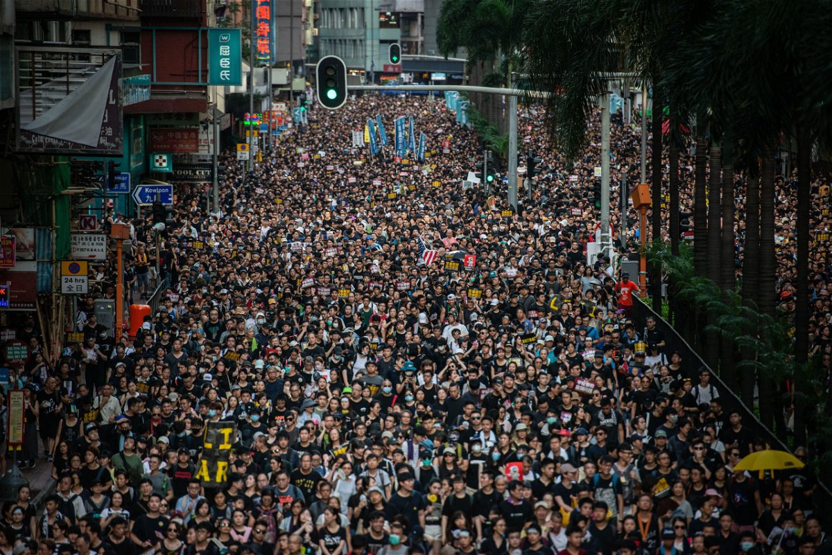 <i>Ivan Abreu/SOPA Images/LightRocket/Getty Images</i><br/>Demonstrators march during the Civil Human Rights Front march in Wan Chai