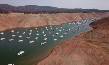 In this aerial photo houseboats sit in low water on Lake Oroville as California's drought emergency worsens