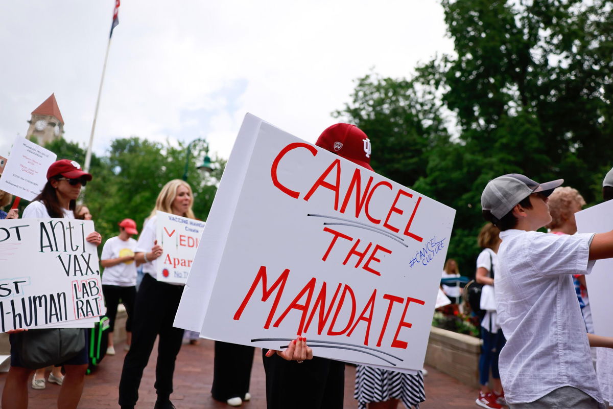 <i>Jeremy Hogan/SOPA Images/LightRocket/Getty Images</i><br/>Protesters gather at Indiana University in June to protest against mandatory Covid vaccinations IU is requiring for students