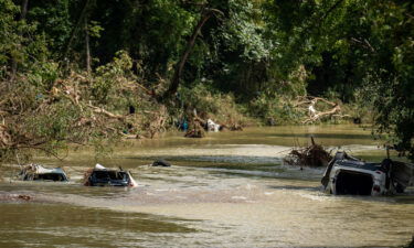 Vehicles are submerged in Trace Creek as a result of severe weather in Waverly.