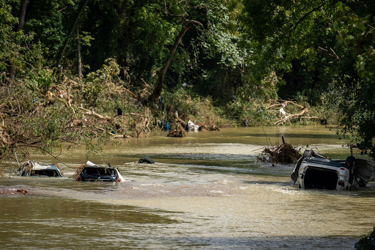 <i>Andrew Nelles/The Tennessean/AP</i><br/>Vehicles are submerged in Trace Creek as a result of severe weather in Waverly.