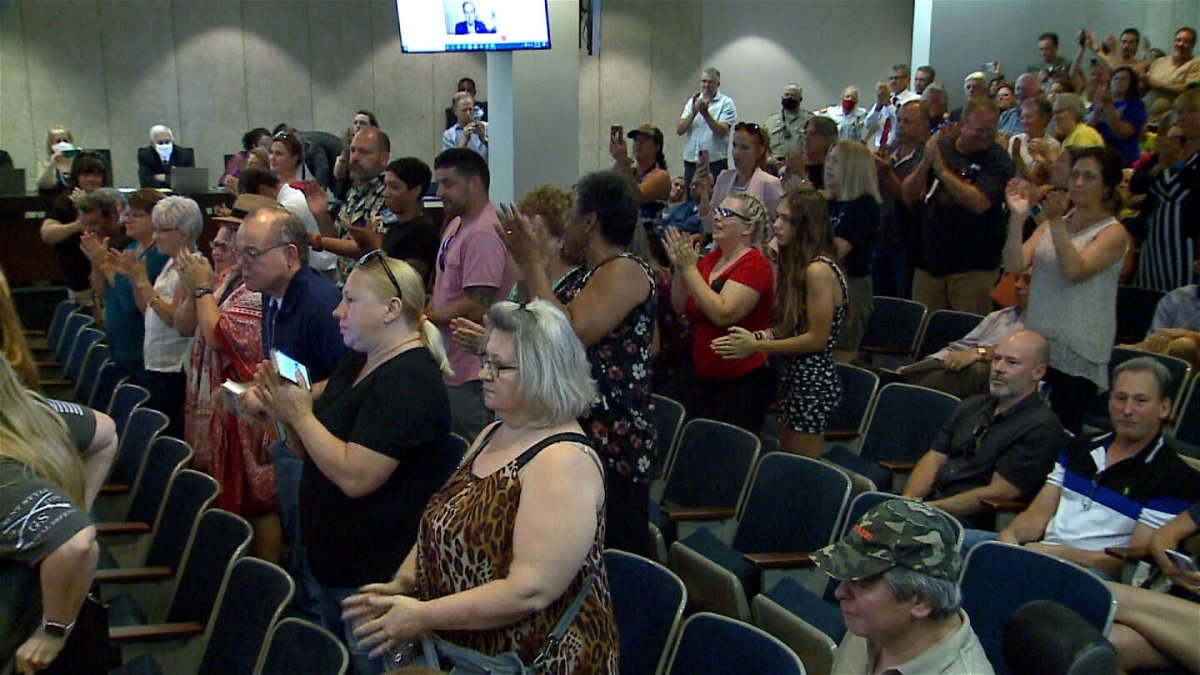 <i>KMOV</i><br/>Officials say a person who attended a St. Louis County Council meeting where officials voted to overturn a mask mandate has tested positive for Covid-19 as many attendees pictured here at the St. Louis County Council meeting weren't wearing masks.