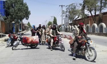 Taliban fighters are shown patrolling the city of Ghazni on Aug. 12.
