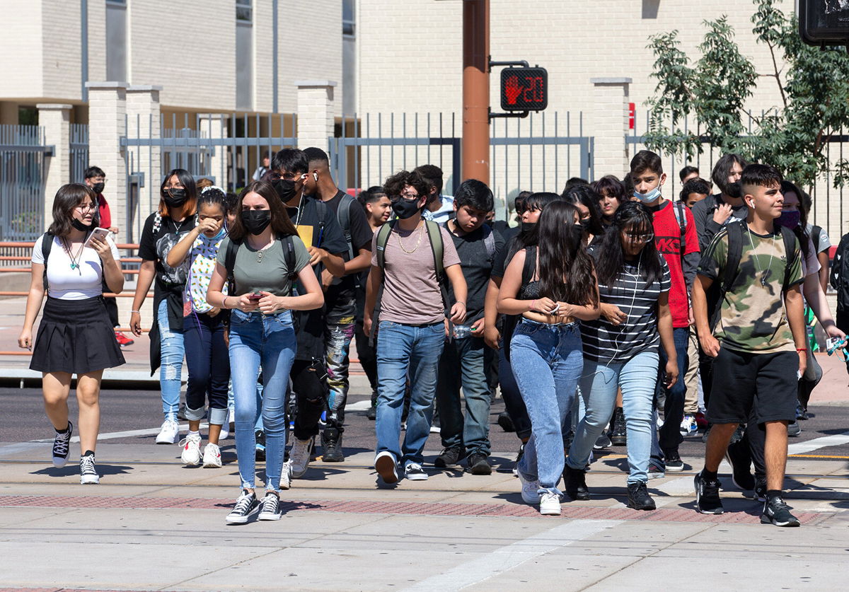 <i>Joseph Cooke/The Arizona Republic/USA Today Network</i><br/>Teacher Douglas Hester sues the Phoenix Union High School District and its governing board over their mask mandate. Students here leave Central High School in Phoenix on August 2.