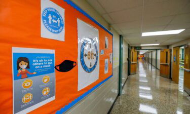 Signs continue to encourage mask wearing and social distancing for the upcoming fall semester despite ventilation improvements at Kelley Lake Elementary School in Decatur