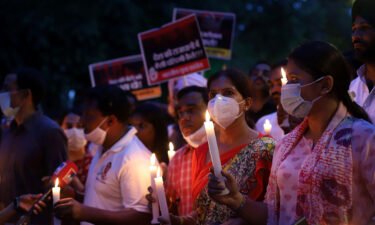 Delhi leaders order judicial inquiry into alleged rape and murder of 9-year-old girl. Protesters here march with lit candles and placards on August 4 in Delhi