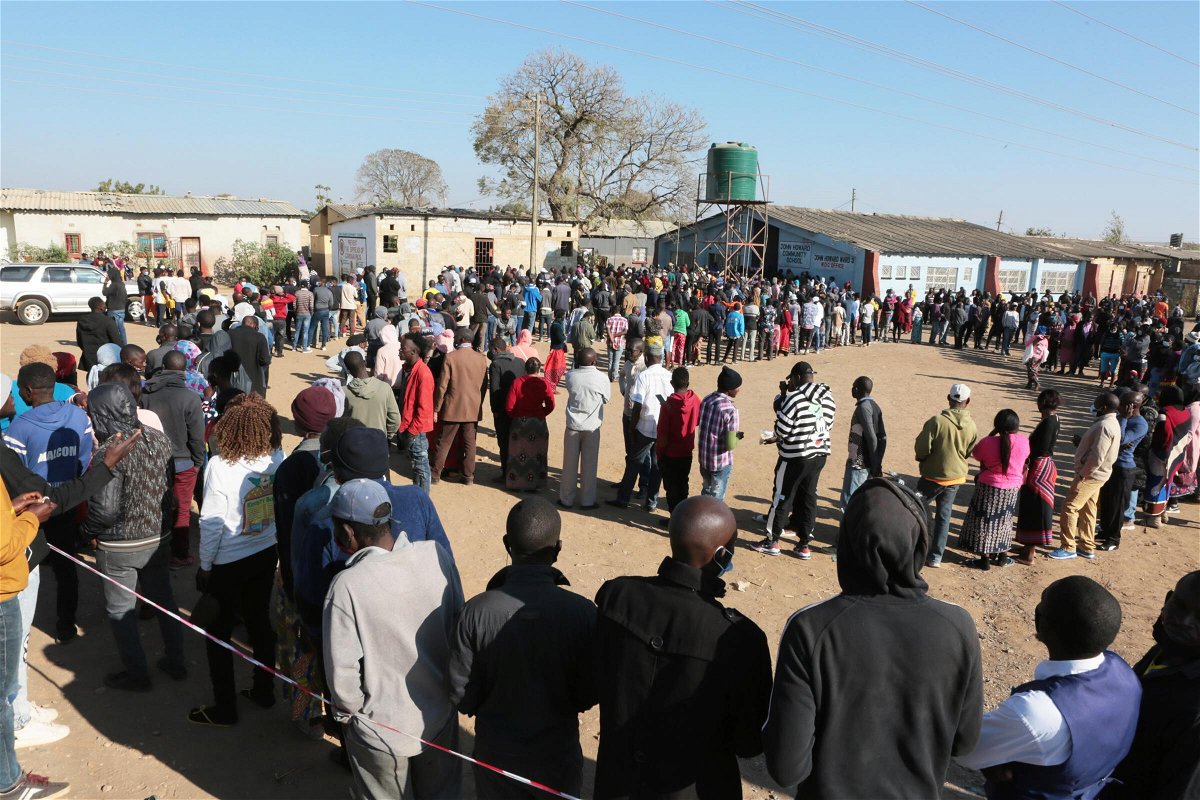 <i>Tsvangirayi Mukwazhi/AP</i><br/>People wait in a long queue at a polling station in Lusaka