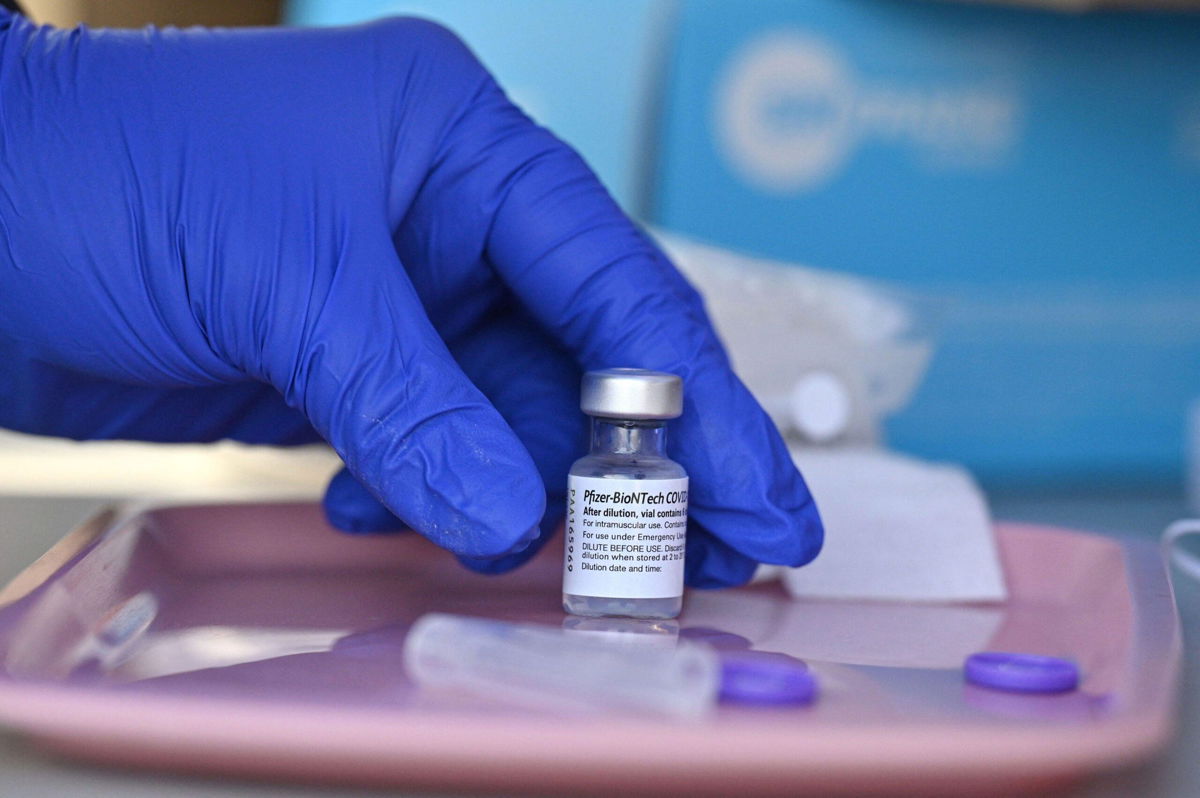 <i>Robyn Beck/AFP/Getty Images</i><br/>The Pfizer-BioNTech vaccine name is Comirnaty.