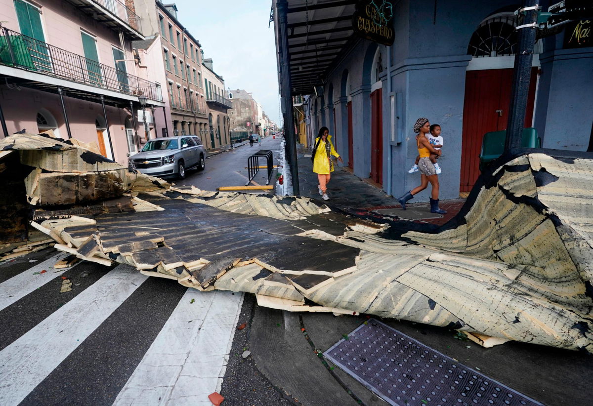 <i>Eric Gay/AP</i><br/>A section of roof that was blown off of a building in the French Quarter by Hurricane Ida winds blocks an intersection on August 30