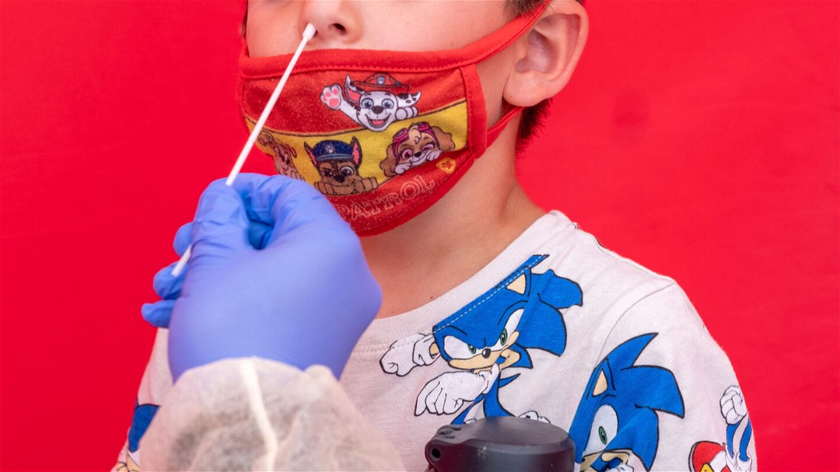 <i>Hans Gutknecht/MediaNews Group/Los Angeles Daily News/Getty Images</i><br/>US Covid-19 cases among children have surged to one of its highest rates of the pandemic .A boy here gets tested at Northridge Middle School on August 11.