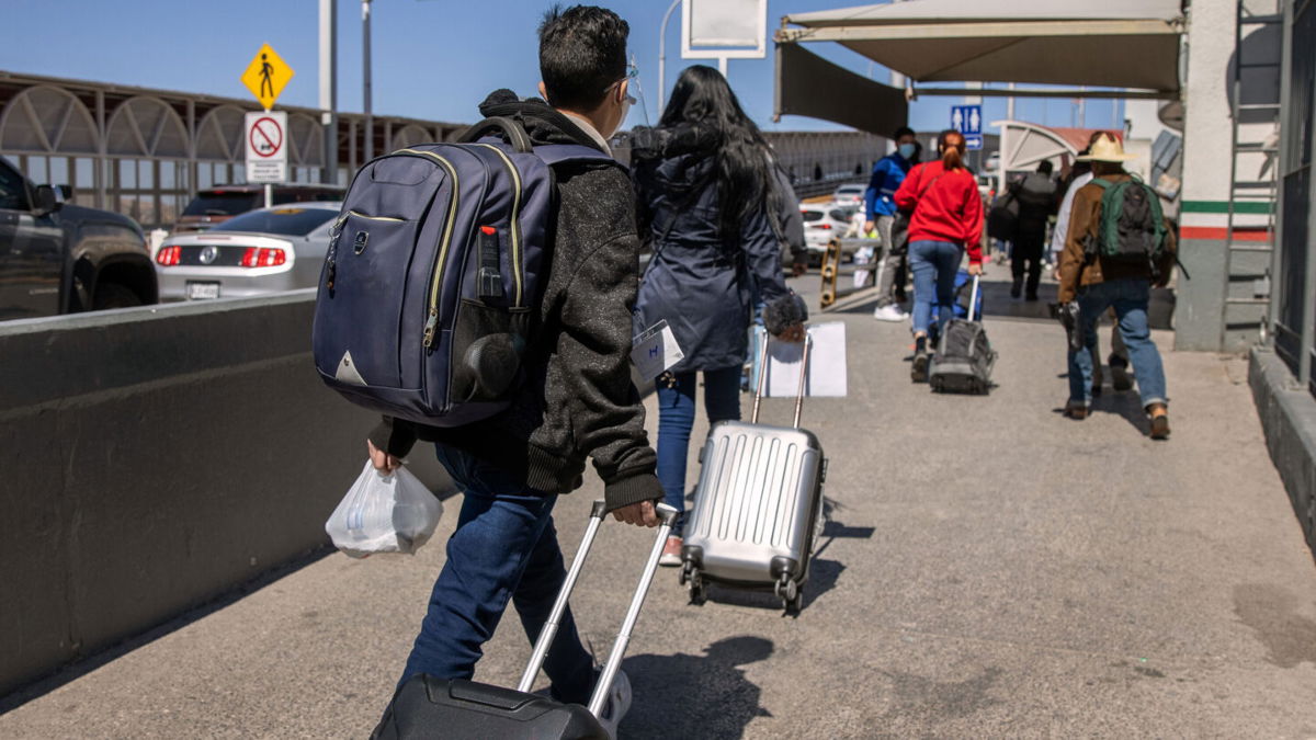 <i>John Moore/Getty Images</i><br/>A federal judge in Texas has ordered the Biden administration to revive a Trump-era border policy that required migrants to stay in Mexico until their US immigration court date.