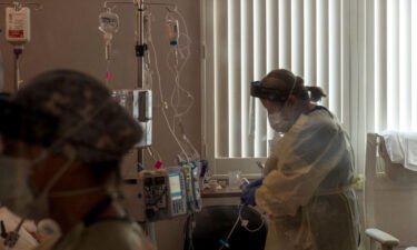 A nurse tends to a Covid-19 patient inside a California ICU.