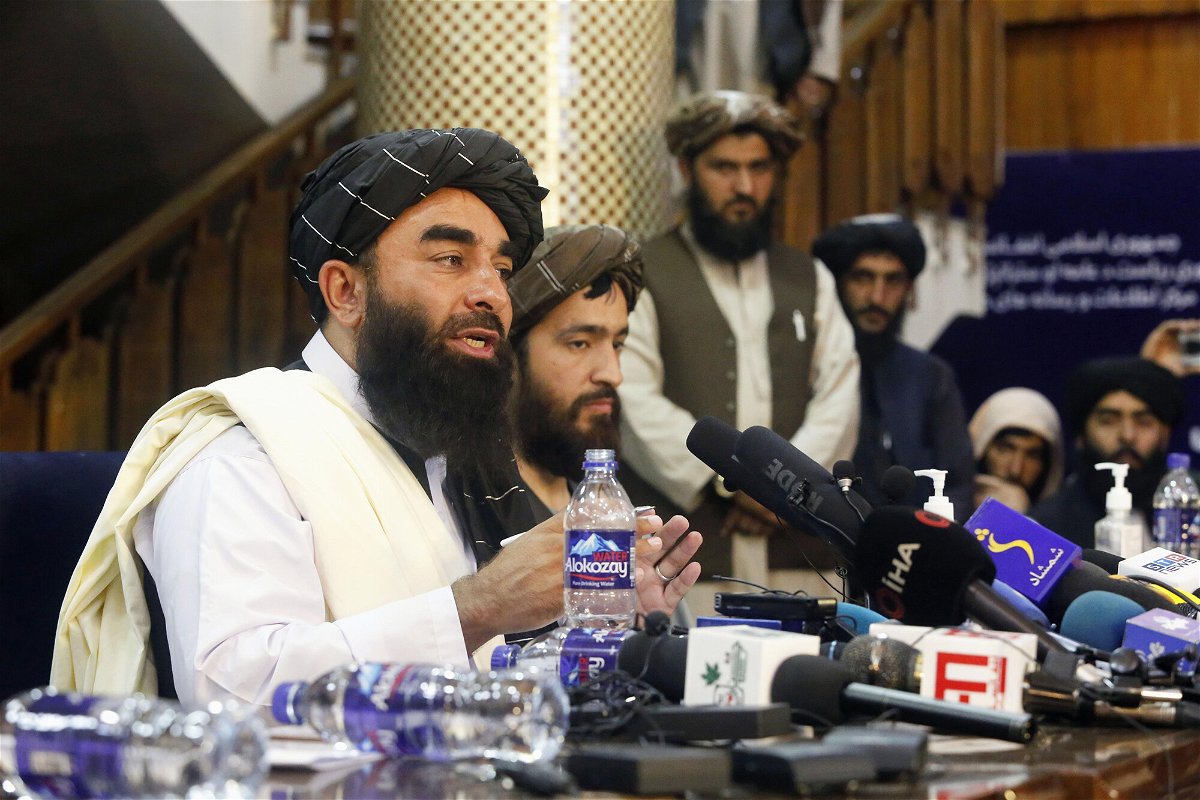 <i>Kyodo News/Getty Images</i><br/>Spokesman Zabihullah Mujahid conducts the Taliban's first news conference since they seized power in Afghanistan.