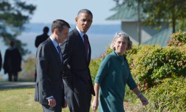 Then-President Barack Obama walks with senior White House adviser David Plouffe