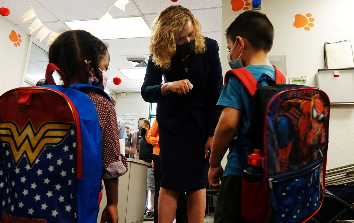 <i>Joe Cavaretta/South Florida Sun-Sentinel/AP</i><br/>Broward and Alachua counties in Florida must allow mask opt-out or start losing funding. Broward County Schools Interim Superintendent Dr. Vickie L. Cartwright here greets students Wednesday