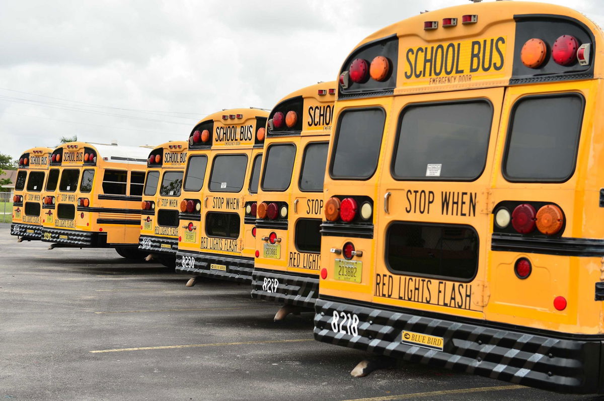 <i>Johnny Louis/Getty Images</i><br/>A fleet of Broward County School buses are parked in a lot on July 21
