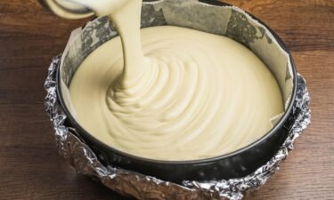 The CDC warns people not to eat raw cake batter because it can contain harmful bacteria that are only killed during cooking.