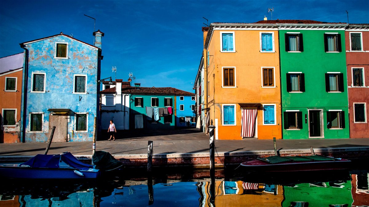 <i>Tiziana Fabi/AFP/Getty Images</i><br/>Tourists can line up in hundreds-strong queues to visit the pretty island of Burano.