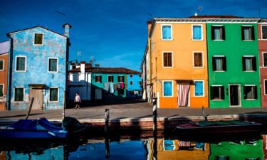 Tourists can line up in hundreds-strong queues to visit the pretty island of Burano.