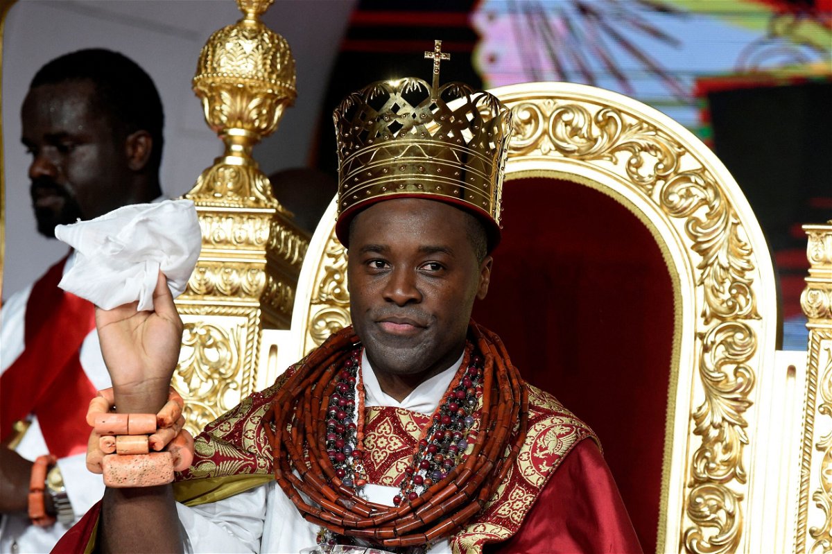 <i>PIUS UTOMI EKPEI/AFP/AFP via Getty Images</i><br/>Prince Tsola Emiko waves after being crowned as the 21st king or the Olu of Warri kingdom and the Ogiame Atuwatse III during his coronation at Ode-Itsekiri on August 21.