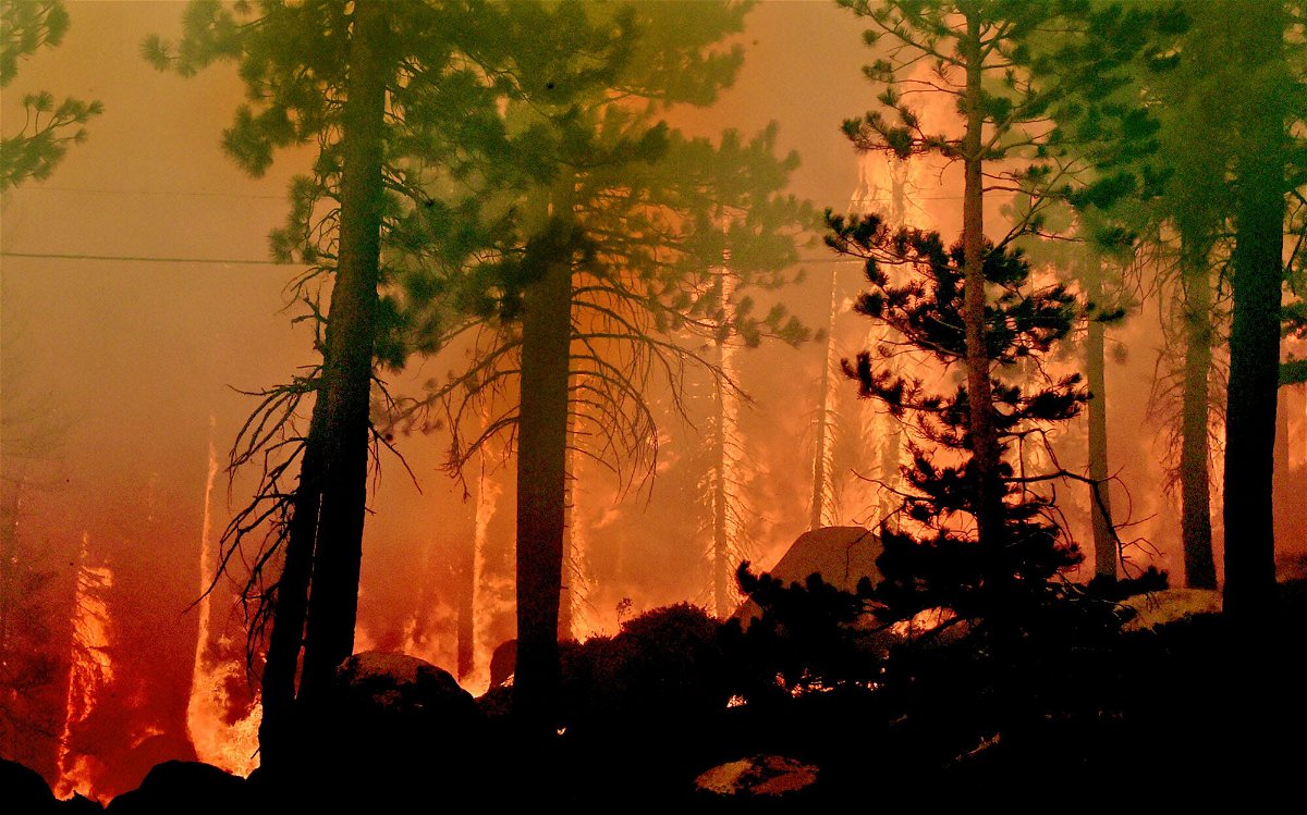 <i>Andy Barron/RGJ/USA Today Network</i><br/>The Caldor Fire burns on both sides of the US-50 11 miles from the Meyers neighborhood in South Lake Tahoe.