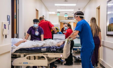 Rates of Covid-19 hospitalizations for children and adults under 50 reach their highest levels yet. Nurses and EMTs here tend to patients in the hallways at the Houston Methodist The Woodlands Hospital on August 18.