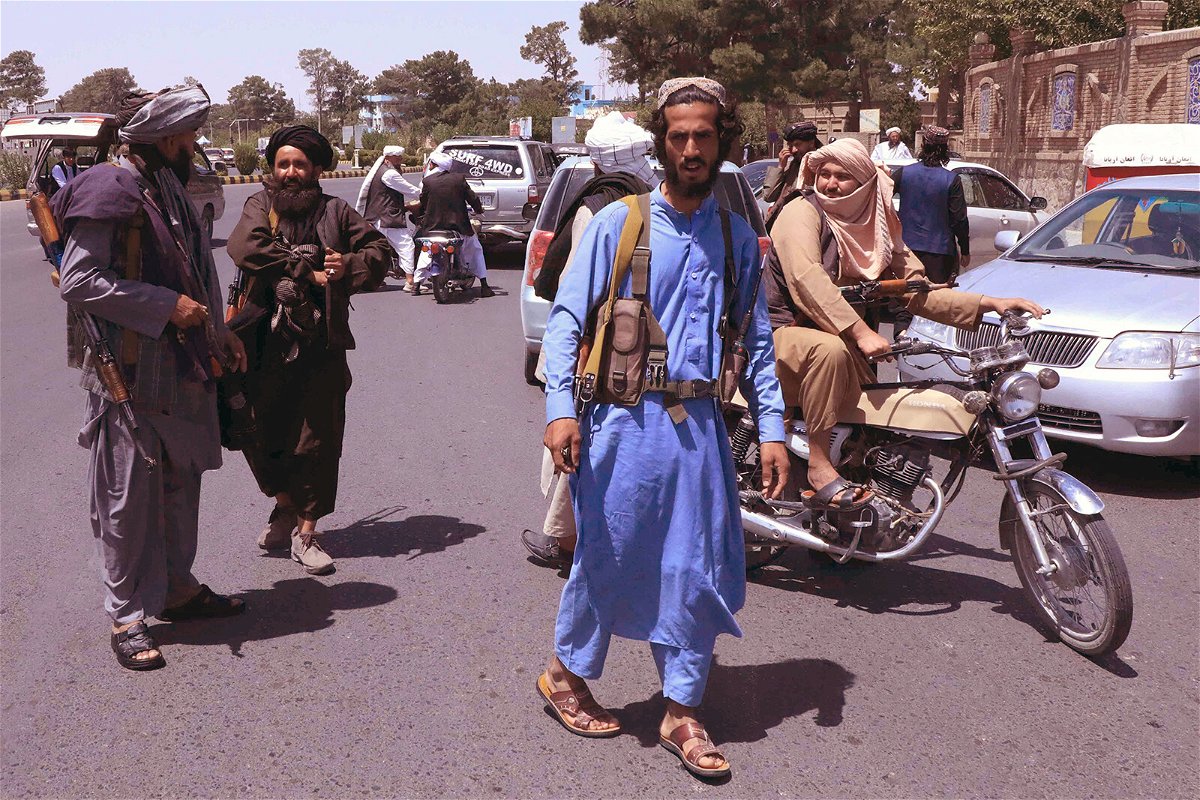 <i>AFP/Getty Images</i><br/>Taliban fighters patrol the streets in Herat on August 14.