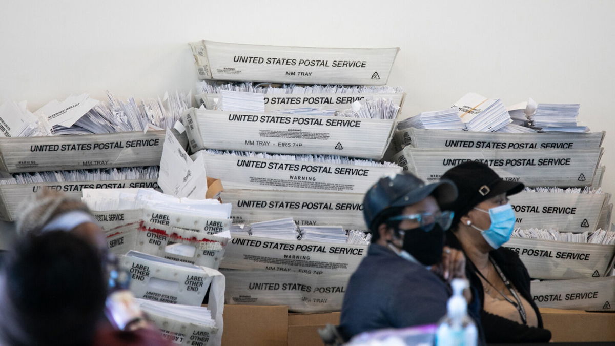 <i>Jessica McGowan/Getty Images</i><br/>A three-person panel to examine the election operations in Georgia's most populous county is named. This image shows piles of absentee ballots on November 6