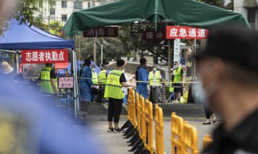 China reported no new locally transmitted Covid-19 cases on Monday for the first time since July. A neighborhood is here placed under lockdown in Shanghai