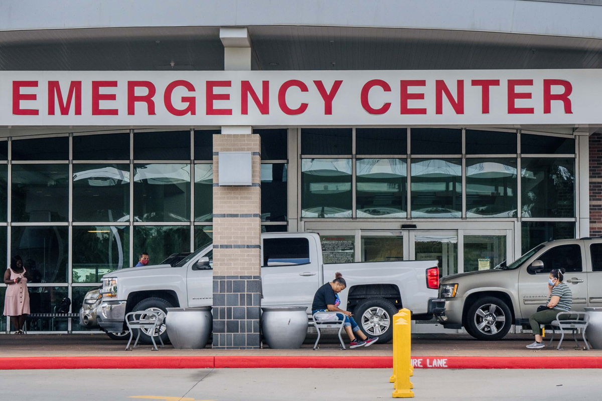 <i>Brandon Bell/Getty Images</i><br/>People wait outside of the Lyndon B. Johnson Hospital on August 10 in Houston. The hospital has set up medical tents in preparation for an overflow of patients being treated for the Covid-19 Delta variant.