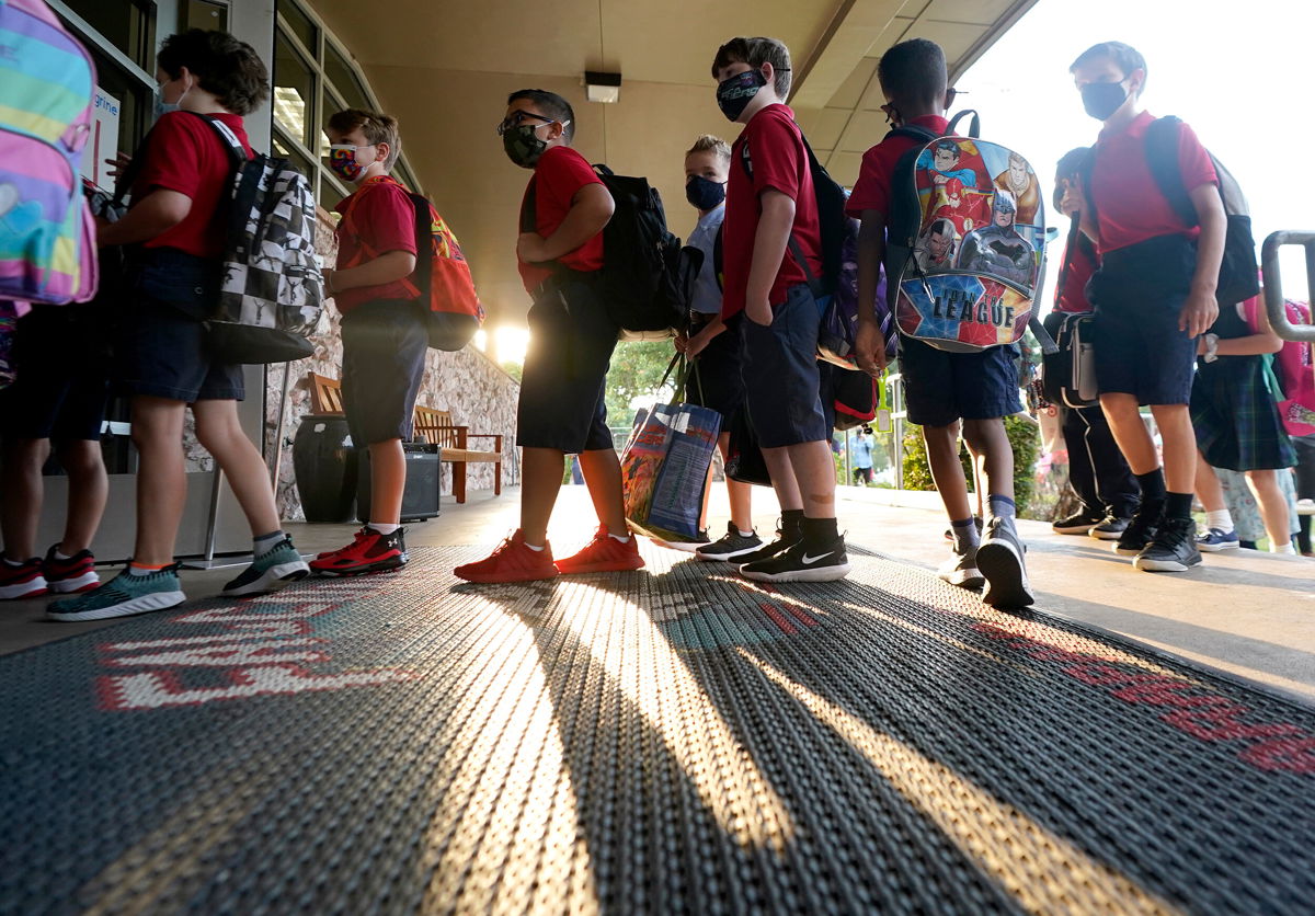<i>LM Otero/AP</i><br/>The Supreme Court of Texas allowed Thursday local mask mandates in Texas. Elementary school students here line up to enter school for the first day of classes in Richardson
