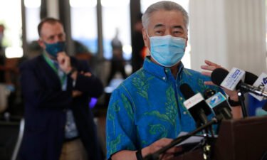 Hawaii Gov. David Ige asked tourists to voluntarily stay away from the state amid a record surge in Covid-19 cases and hospitalizations. Ige is seen here in Honolulu