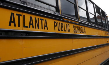 An Atlanta Public Schools bus is parked at Dobbs Elementary School in Atlanta
