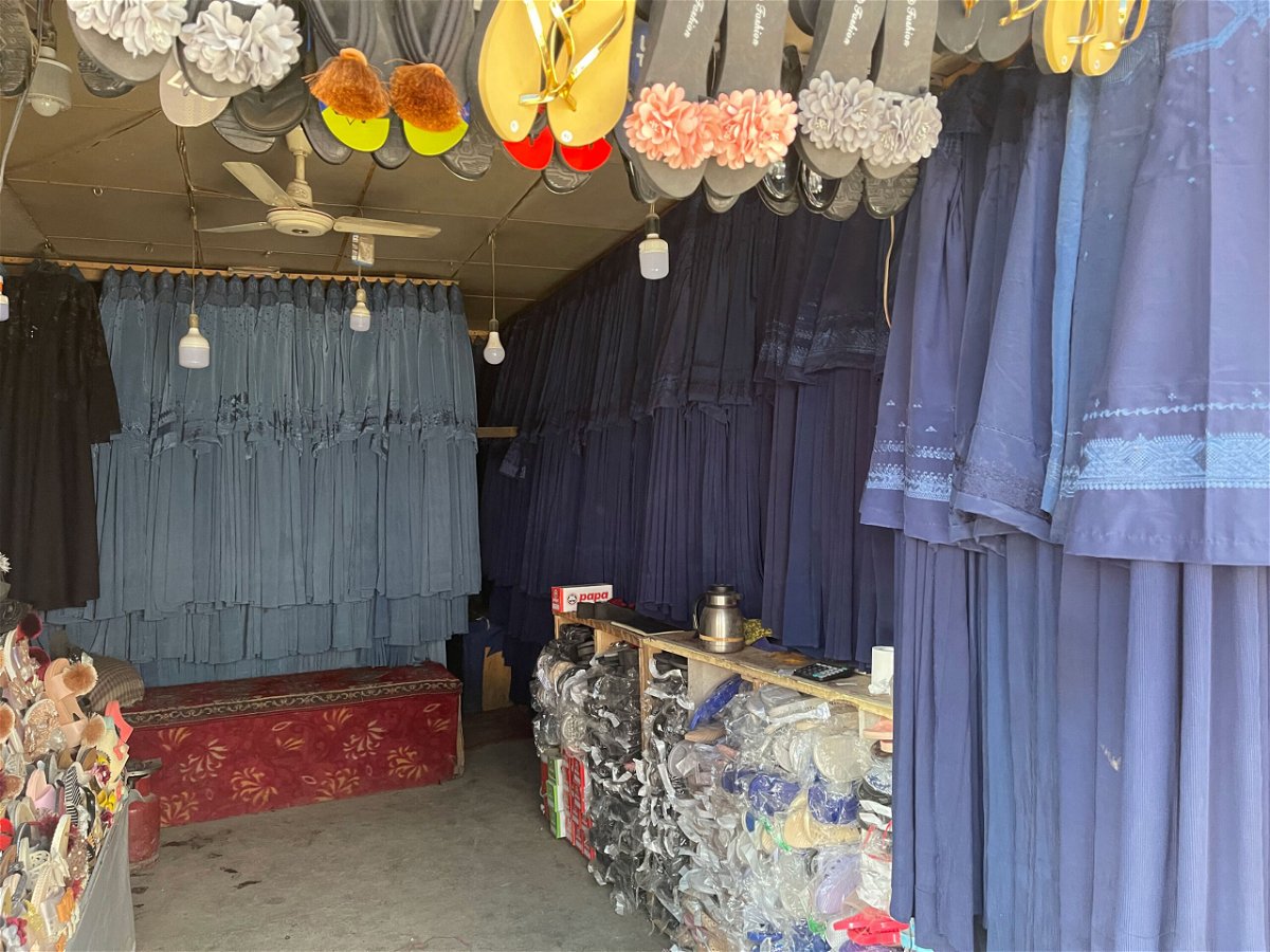 <i>CNN</i><br/>Burqas hang in a market in Kabul on July 31. The price has surged as women rush to cover themselves to avoid attracting the militants' attention.