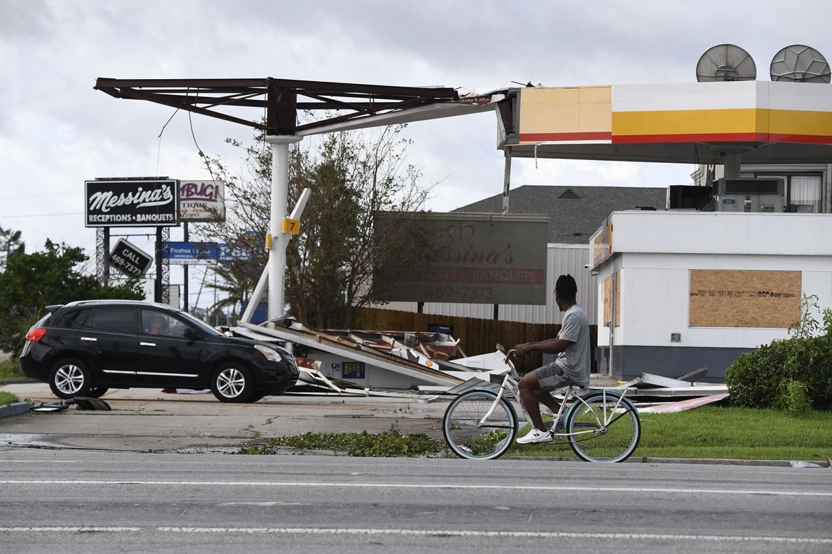 <i>Patrick T. Fallon/AFP/Getty Images</i><br/>Hurricane Ida's direct hit on the nation's oil and gasoline industry could send gas prices higher. Pictured is damaged Shell station in Kenner