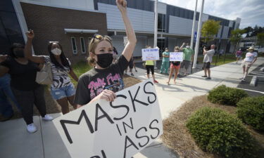 Pro-mask wearing parents stage a protest at the Cobb County School Board headquarters