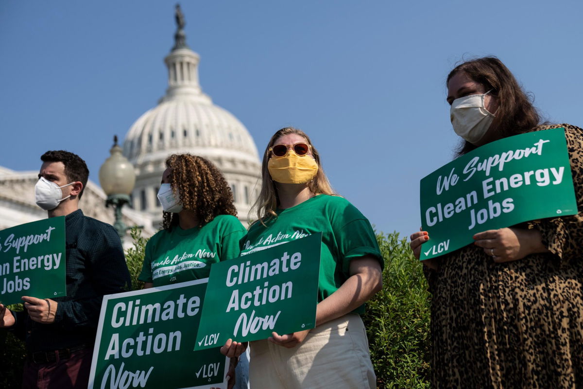 <i>Drew Angerer/Getty Images</i><br/>The League of Conservation Voters and Climate Power plan pro-climate pressure campaigns during August recess. Activists are seen here  outside the US Capitol on July 28