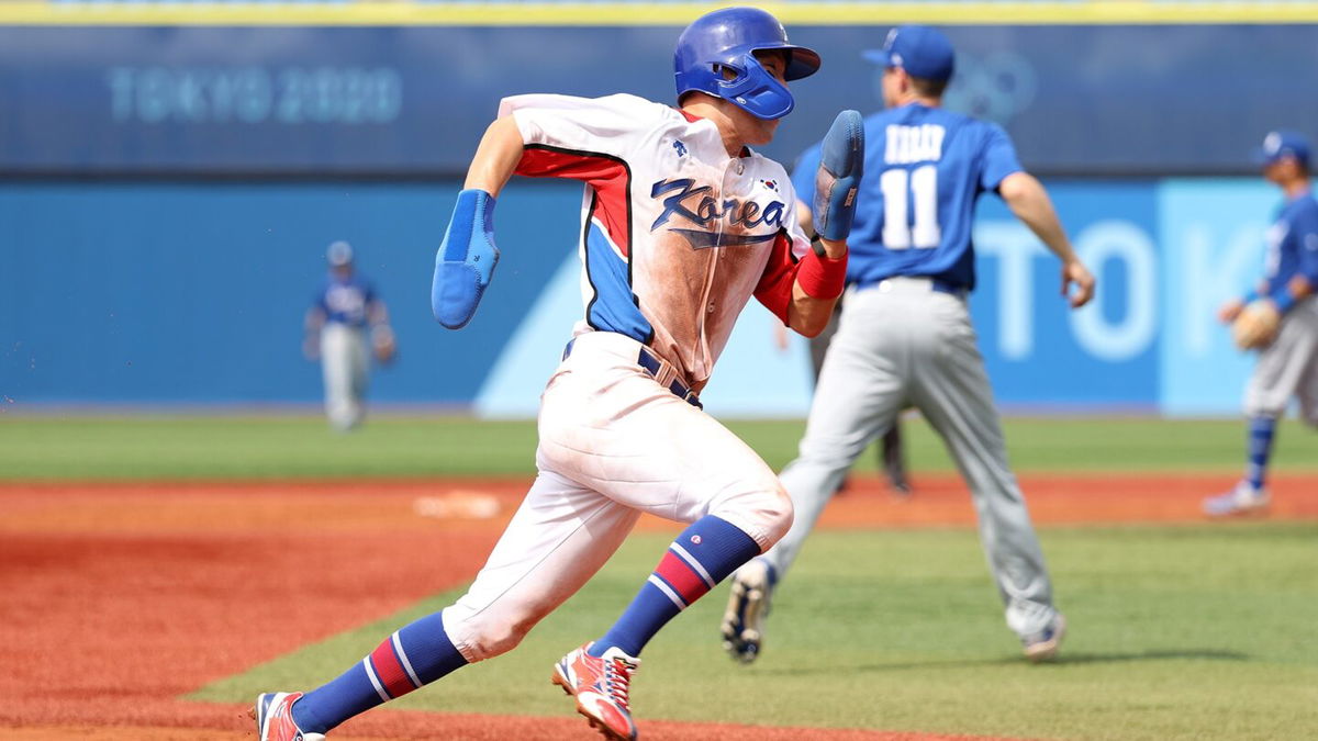 Park Hae-Min of South Korea runs home in the fifth inning against Israel during the knockout stage the Olympic baseball tournament.