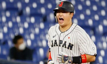 Infielder Munetaka Murakami of Japan celebrates hitting a solo home run in the third inning during the gold medal baseball game against United States.