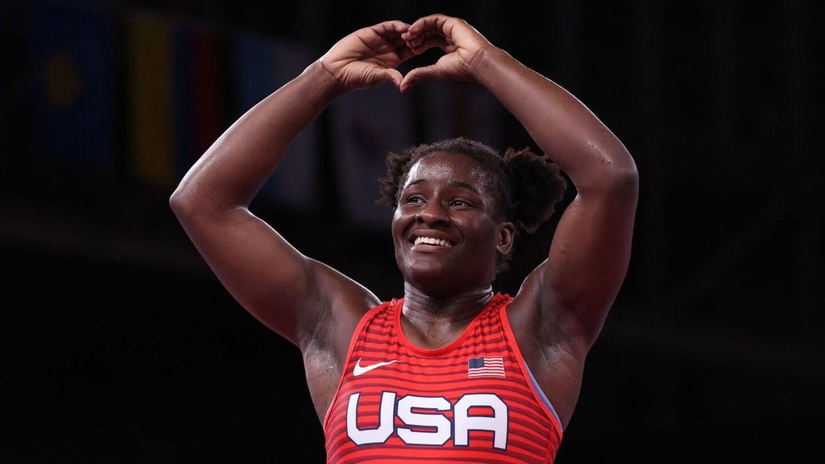 Tamyra Mariama Mensah-Stock celebrate her gold medal victory against Nigeria's Blessing Oborududu in their women's freestyle 68kg wrestling final match during the Tokyo 2020 Olympic Games