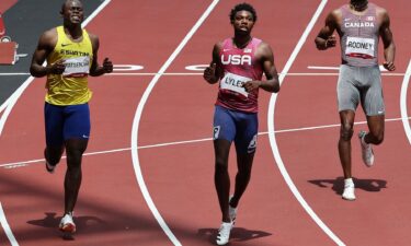 USA's Noah Lyles reacts after winning ahead of second-placed Sibusiso Matsenjwa and Canada's Brendon Rodney in the men's 200m heats during the Tokyo 2020 Olympic Games