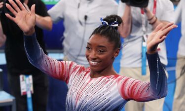 Simone Biles celebrating during her balance beam final