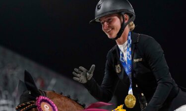 Julia Krajewski smiles on her horse