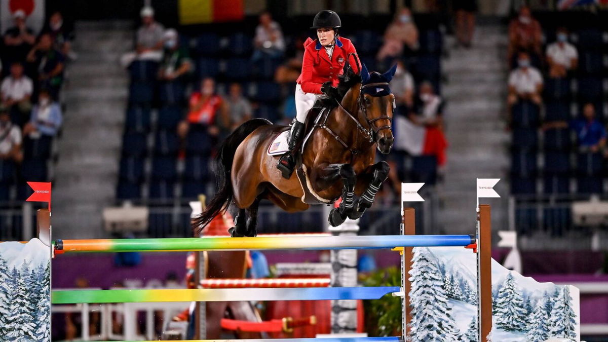 Jessica Springsteen and Don Juan go over a multi-colored jump with sides painted like snow