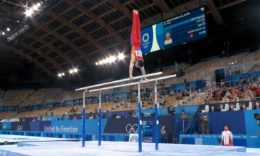 Zou Jingyuan wins parallel bars final with 16.233