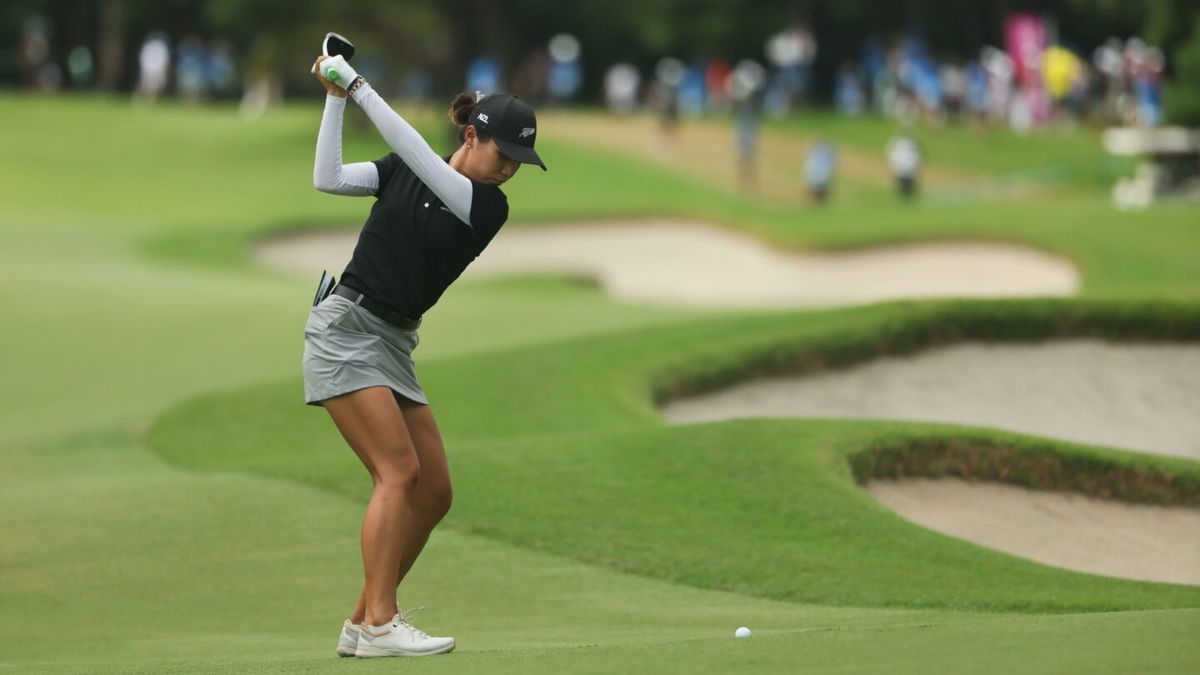 Lydia Ko ricochets a shot off the flag