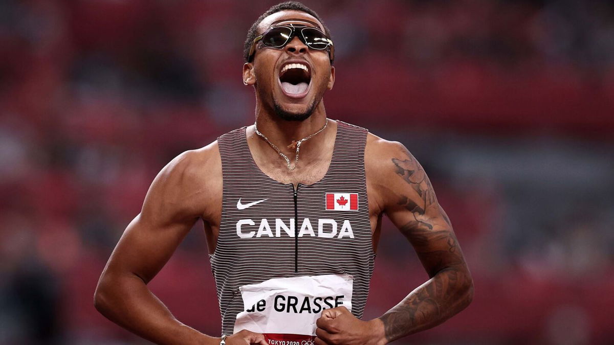 Andre De Grasse lets out a scream after a successful race