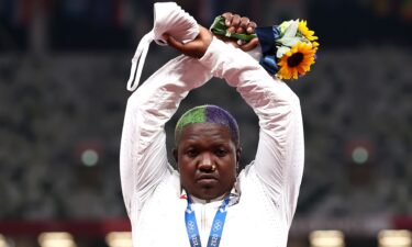 Raven Saunders of Team United States makes an 'X' gesture during the medal ceremony for the Women's Shot Put on day nine of the Tokyo 2020 Olympic Games