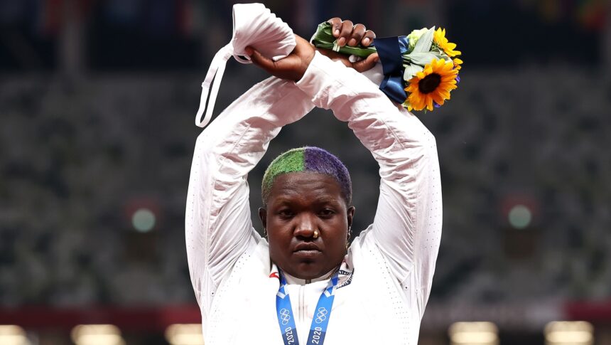 Raven Saunders of Team United States makes an 'X' gesture during the medal ceremony for the Women's Shot Put on day nine of the Tokyo 2020 Olympic Games